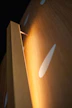 Close-up of custom acoustic panels blending seamlessly with elegant wood finishes.