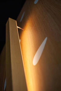 Close-up of custom furniture made from wood panels in a cozy home setting