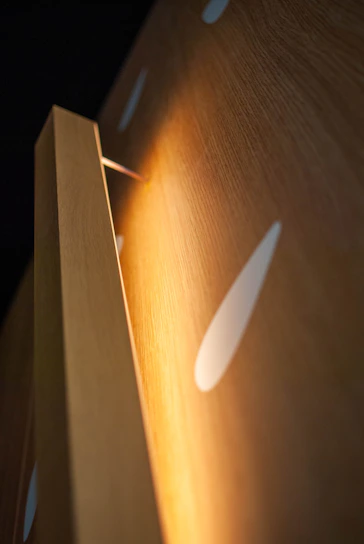 Close-up of custom furniture made from wood panels in a cozy home setting