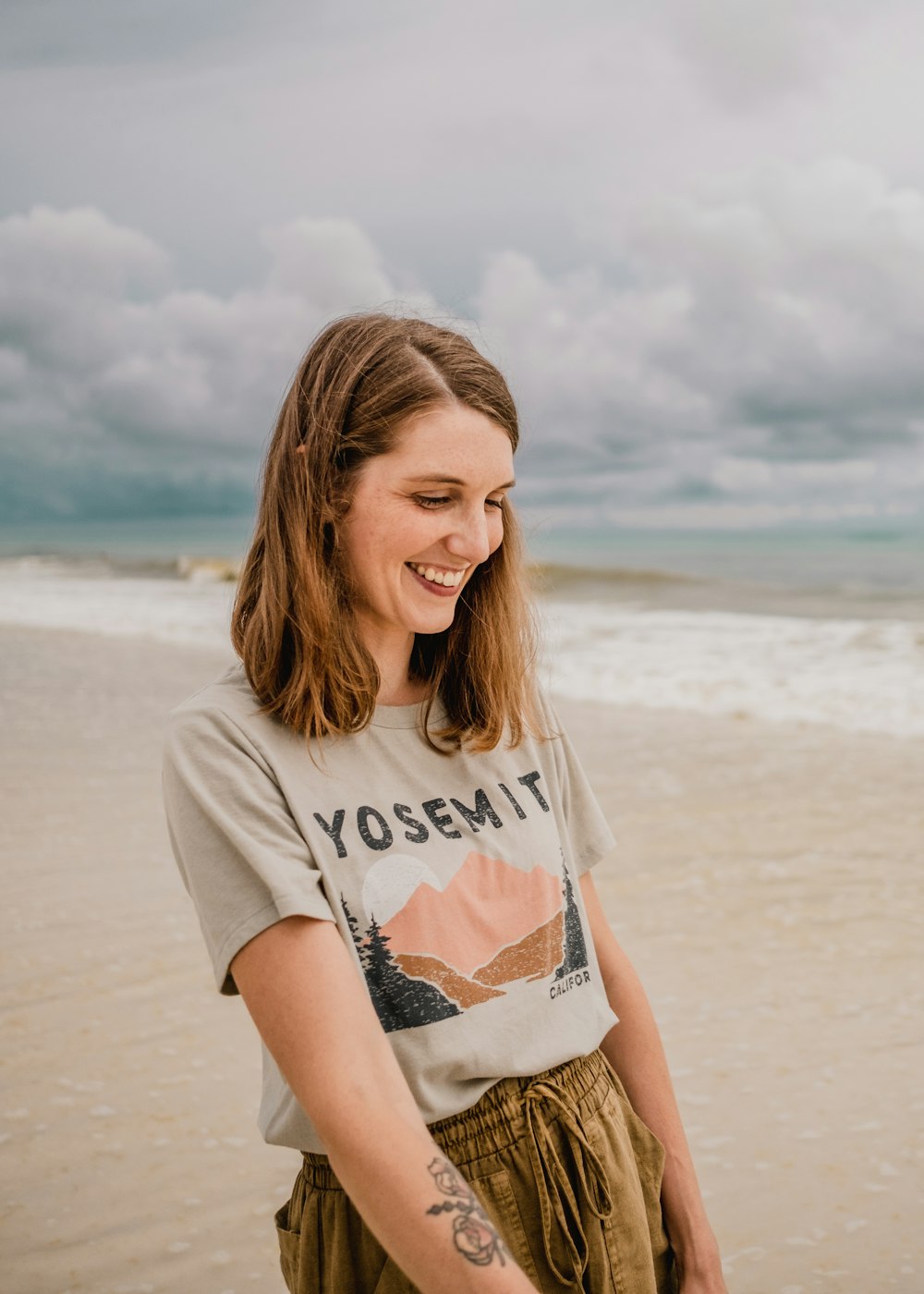 a person standing in front of a beach