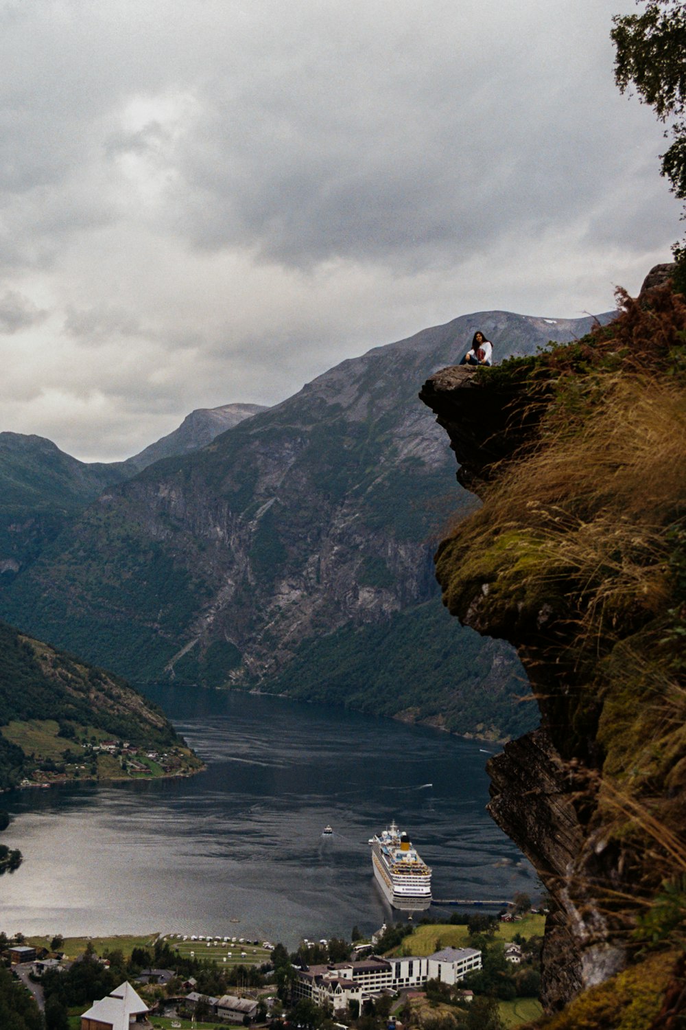 a large body of water with a mountain in the background