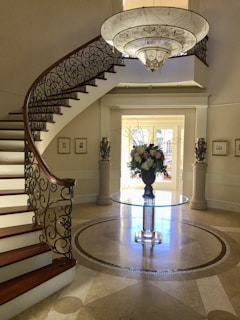 An inviting entryway showcasing a stylish staircase and decorative accents.