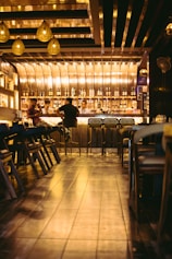 a group of people sitting at a bar