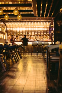 a group of people sitting at a bar