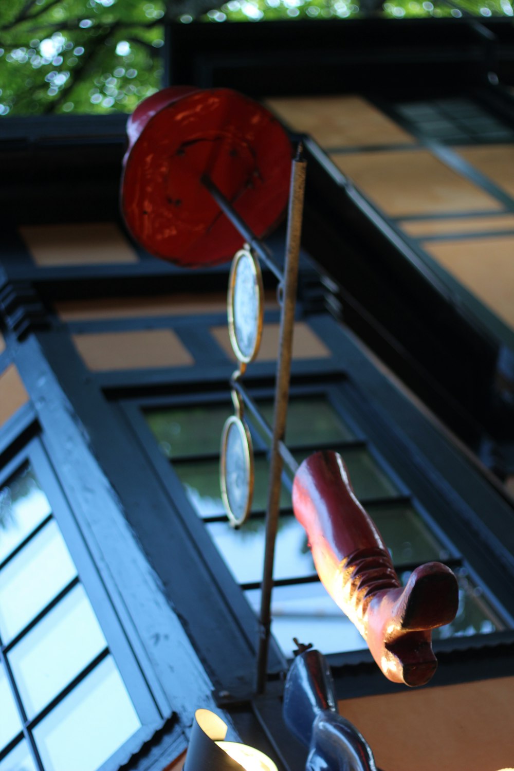 a red heart shaped object on a stick