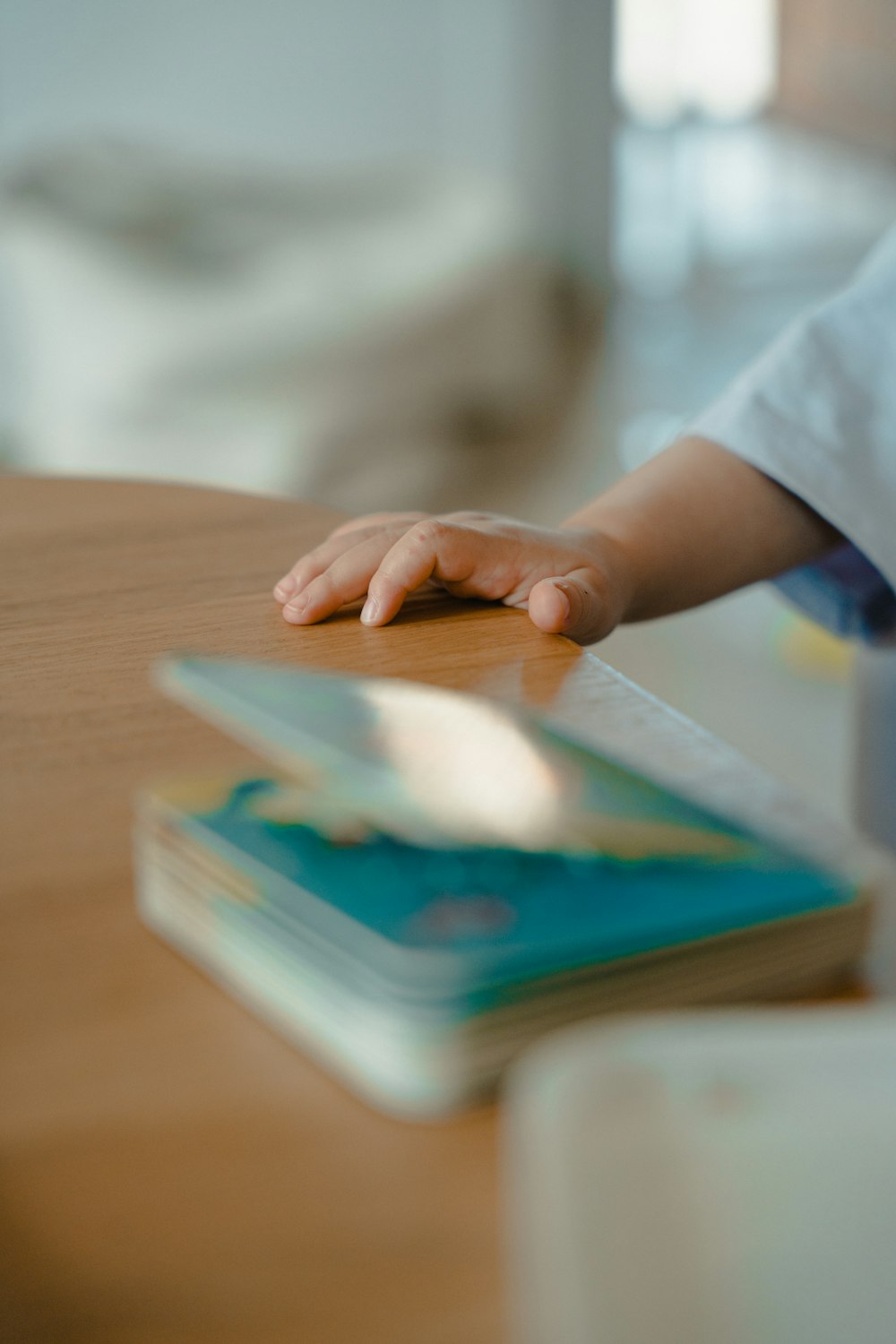 a hand holding a tablet