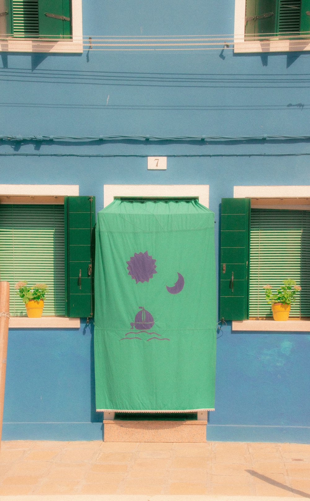 a green door with a cartoon on it