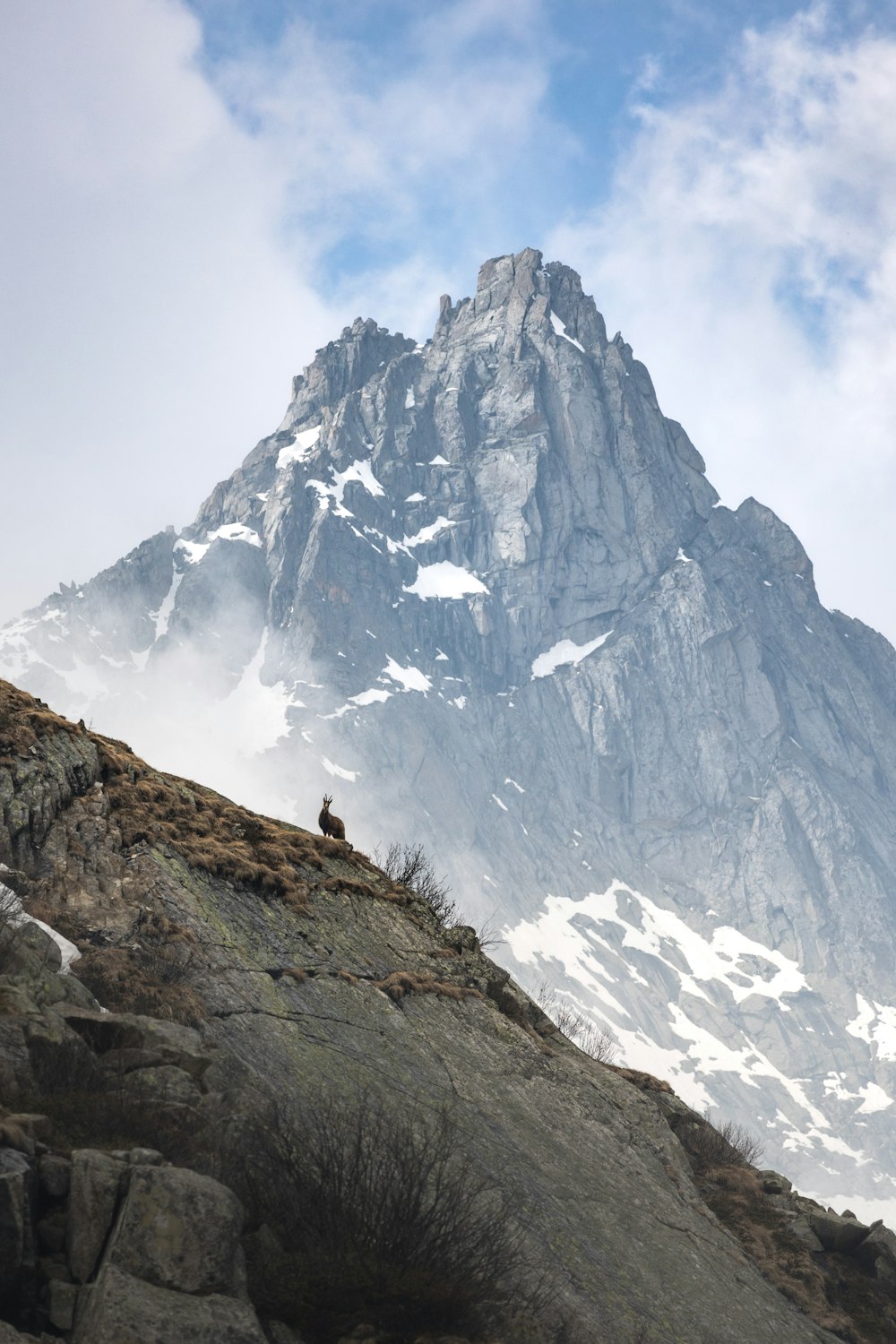 a person standing on a rocky mountain