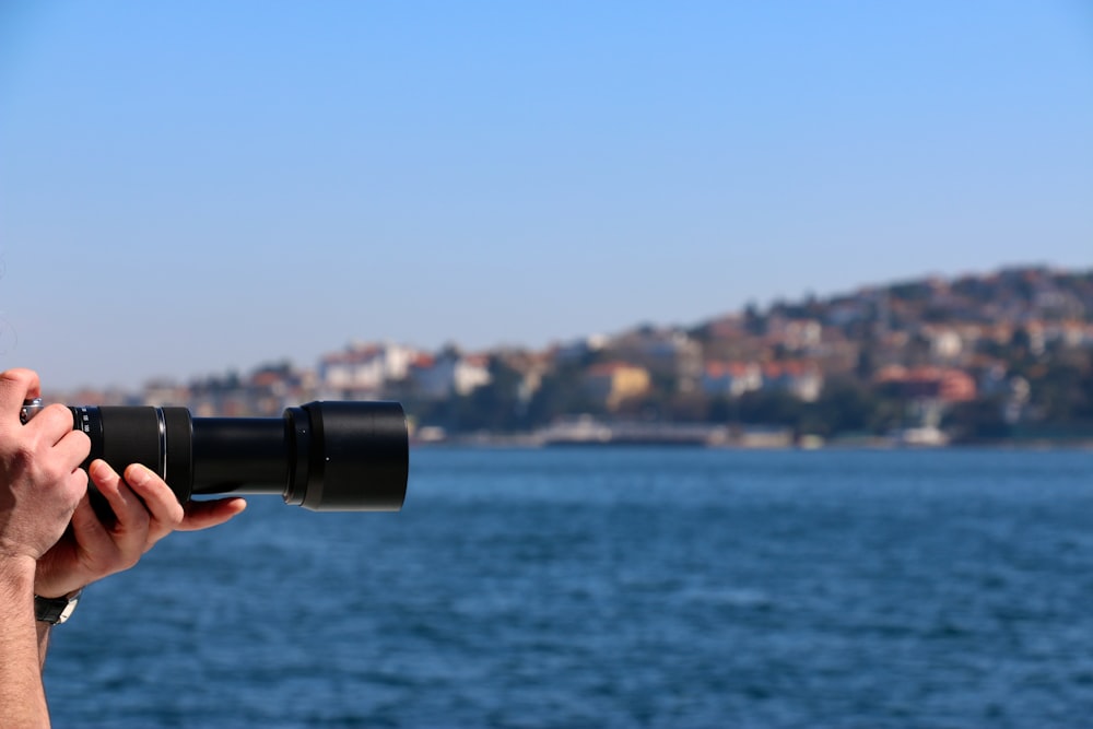 a person holding a camera