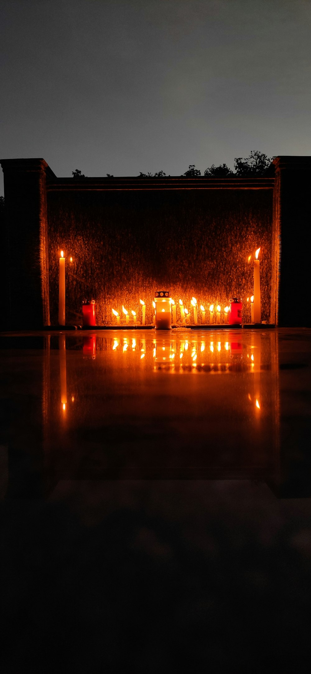 a row of candles on a wall