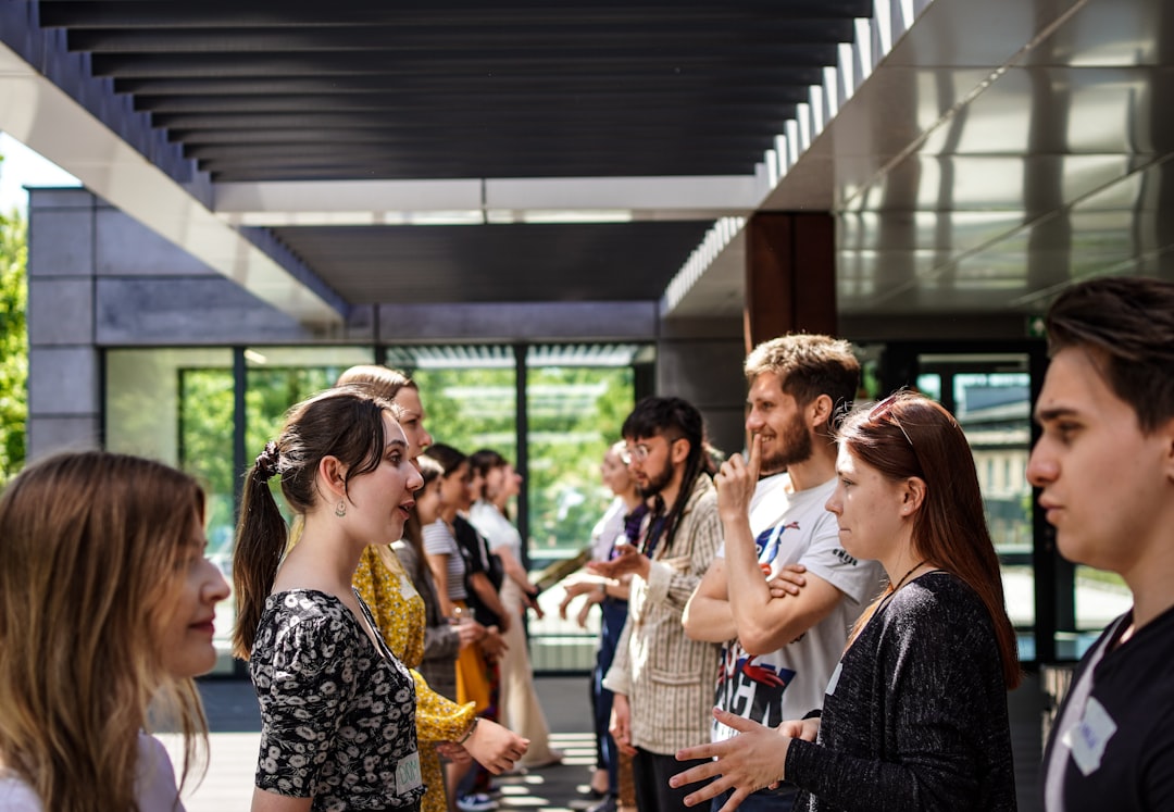 a group of people standing outside,