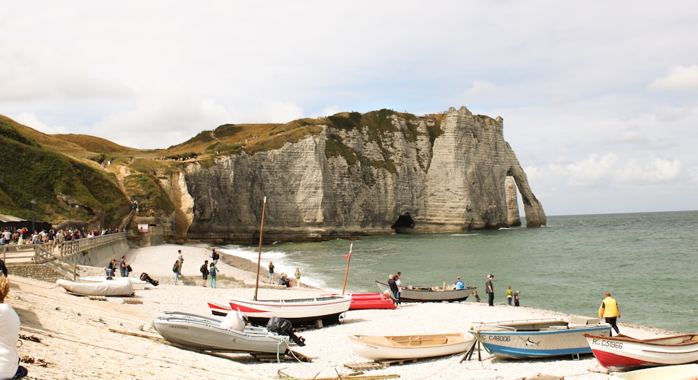 a group of boats on a beach