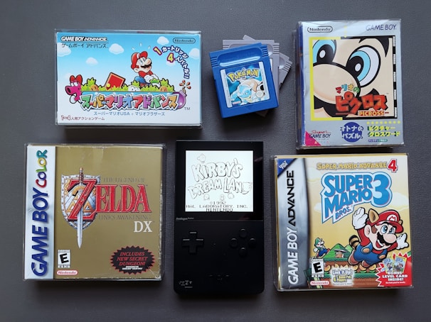 A stack of used Nintendo DS game cases showing well-loved titles
