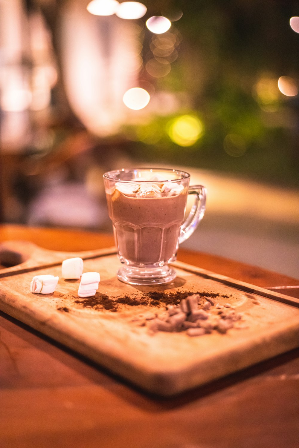 a glass of liquid on a table