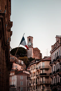 A hopeful sunrise over Magnac-Laval's town hall, symbolizing new beginnings.