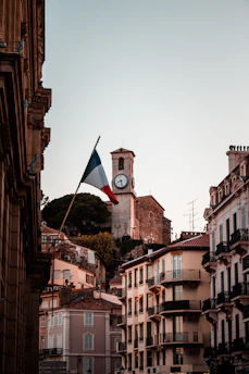 A hopeful sunrise over Magnac-Laval's town hall, symbolizing new beginnings.