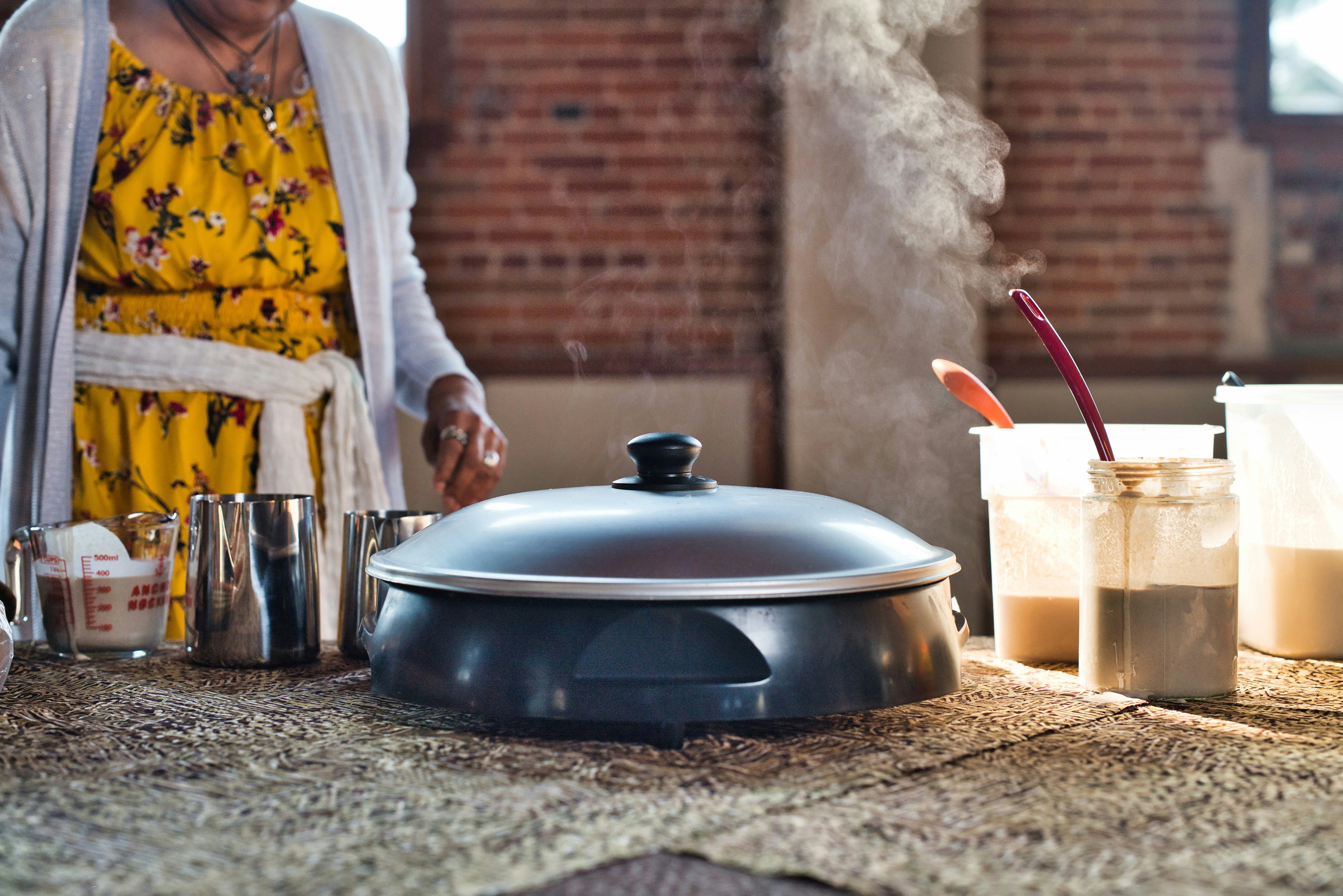 a person cooking food on a stove