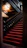 Close-up of a beautifully crafted bespoke stair runner in a softly lit elegant hallway.