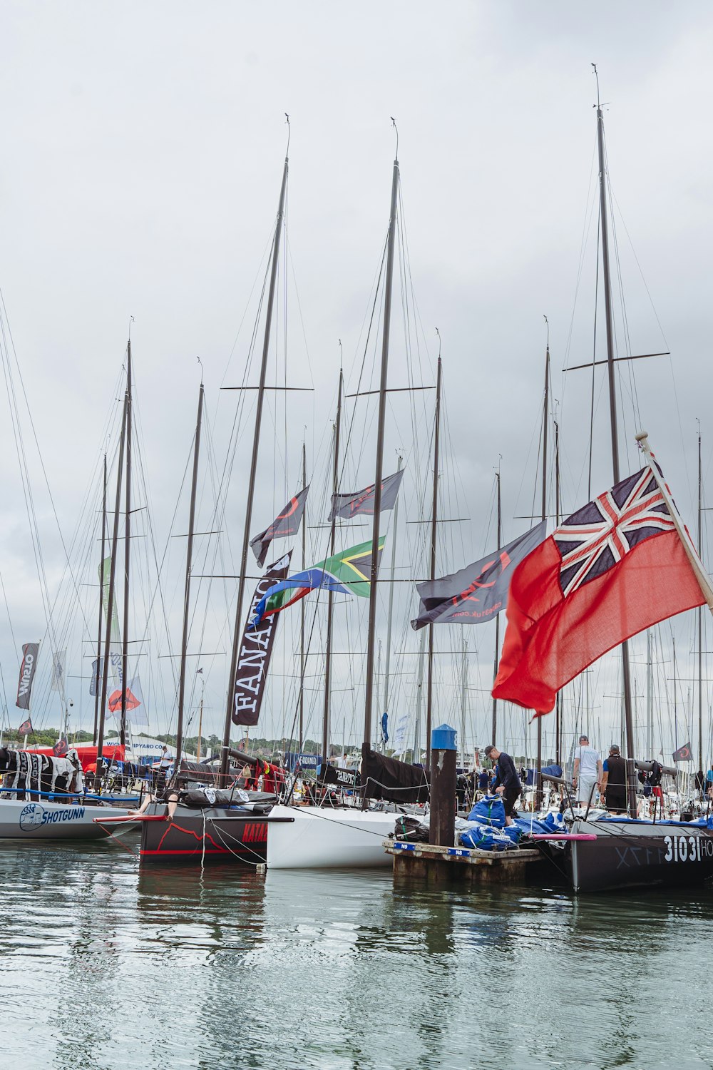 a group of boats with flags