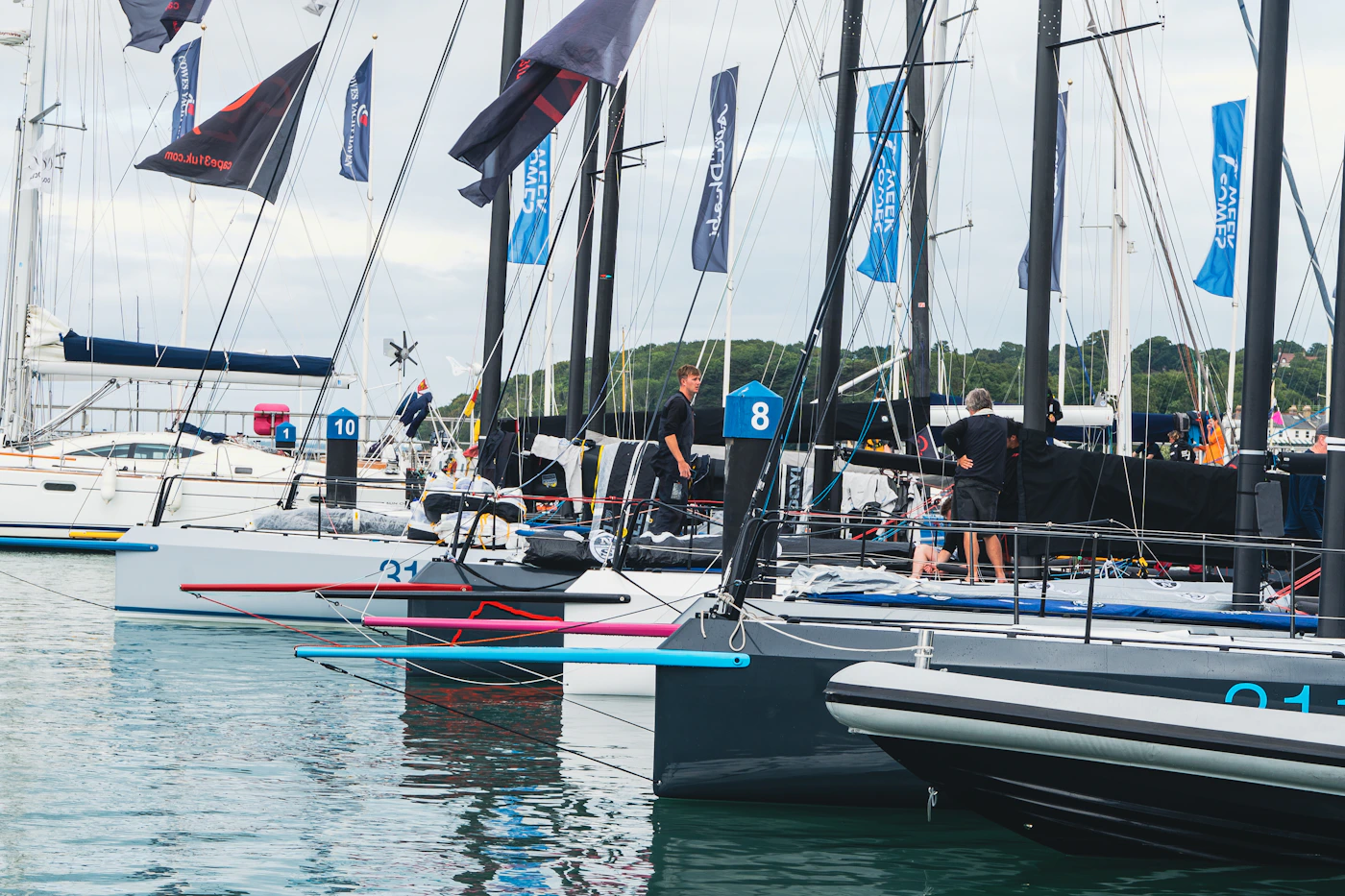 a group of sailboats on the water