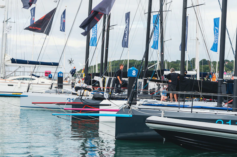 a group of sailboats on the water