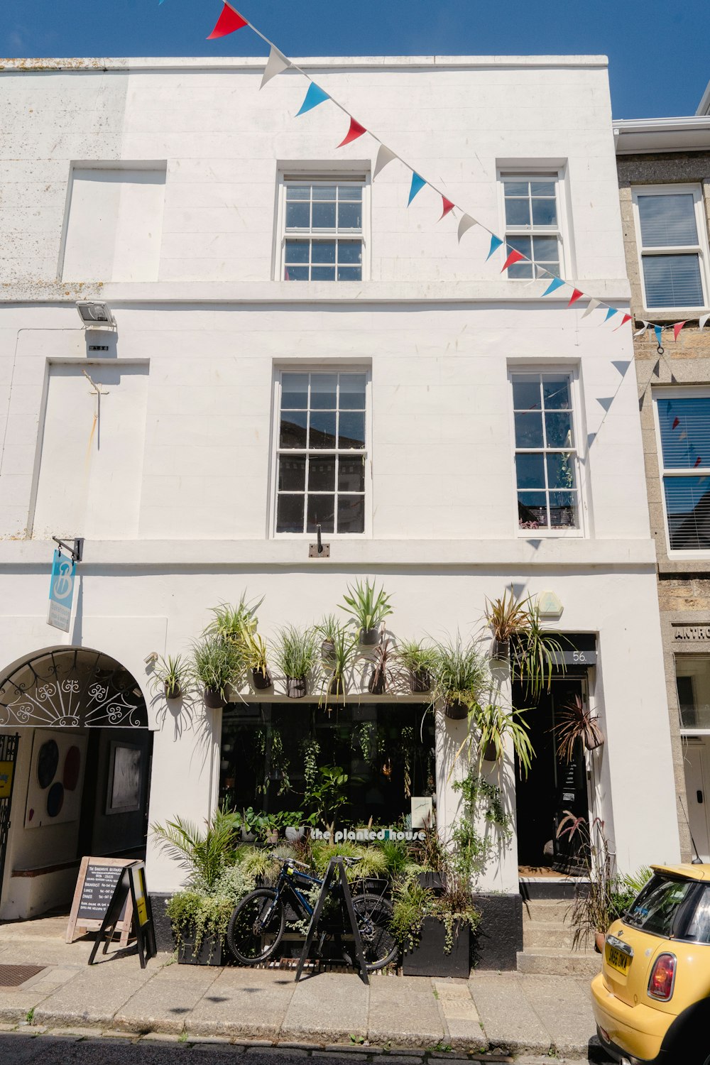 a white building with a flag on top