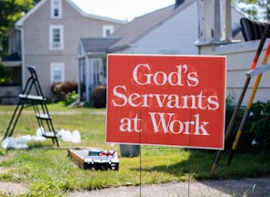 a sign in front of a house