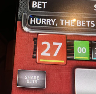 Excited player holding phone showing free spin bonus round in online casino