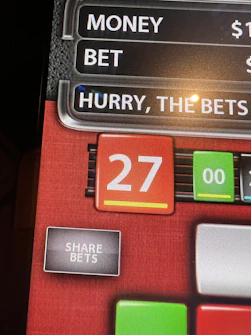 Close-up of a winning betting slip highlighted with green marks and positive returns.