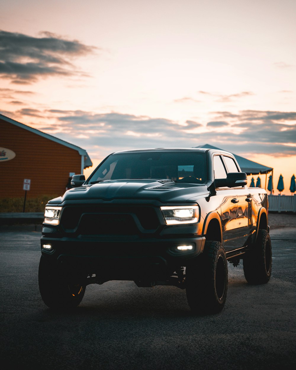 a black truck parked on a street