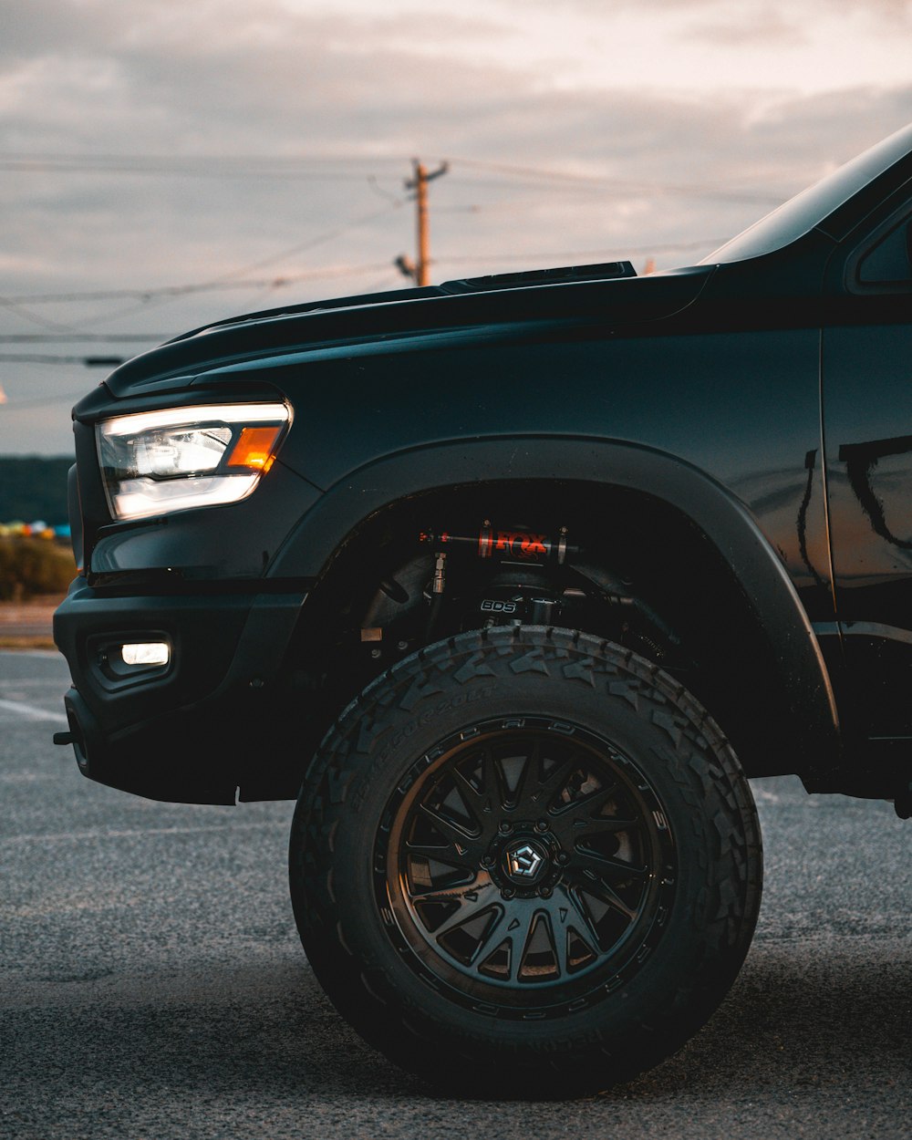 a black car with large tires