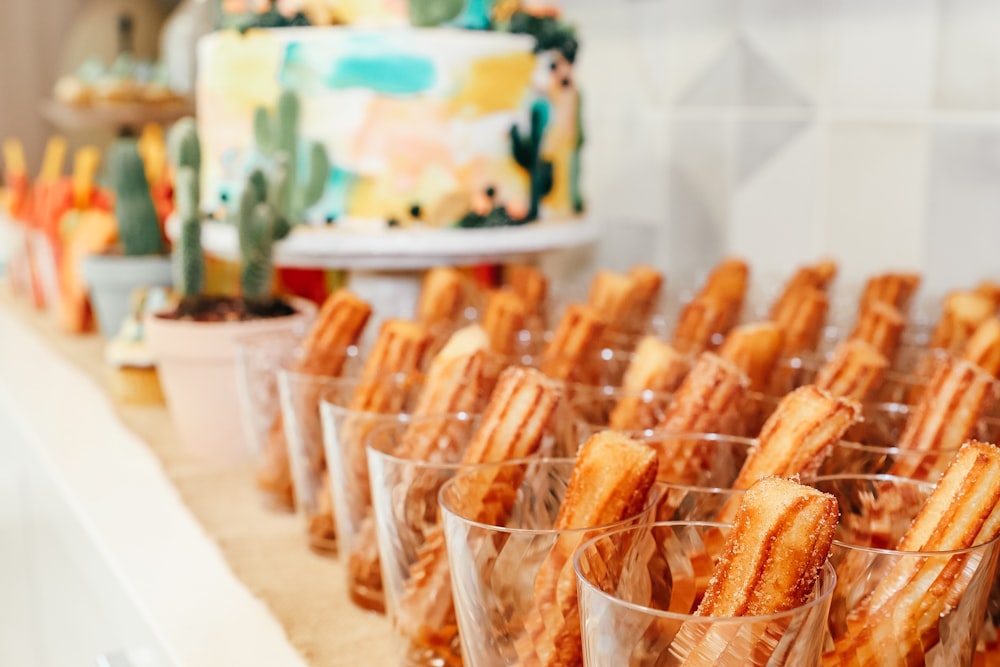 a group of plastic cups with food in them