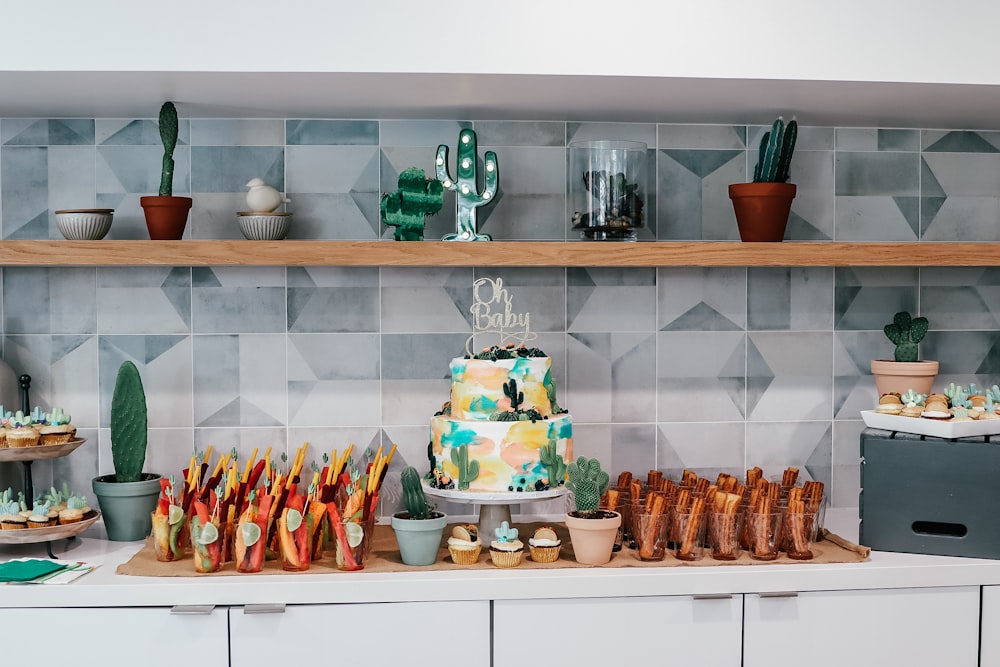 a shelf with a cake and other objects on it