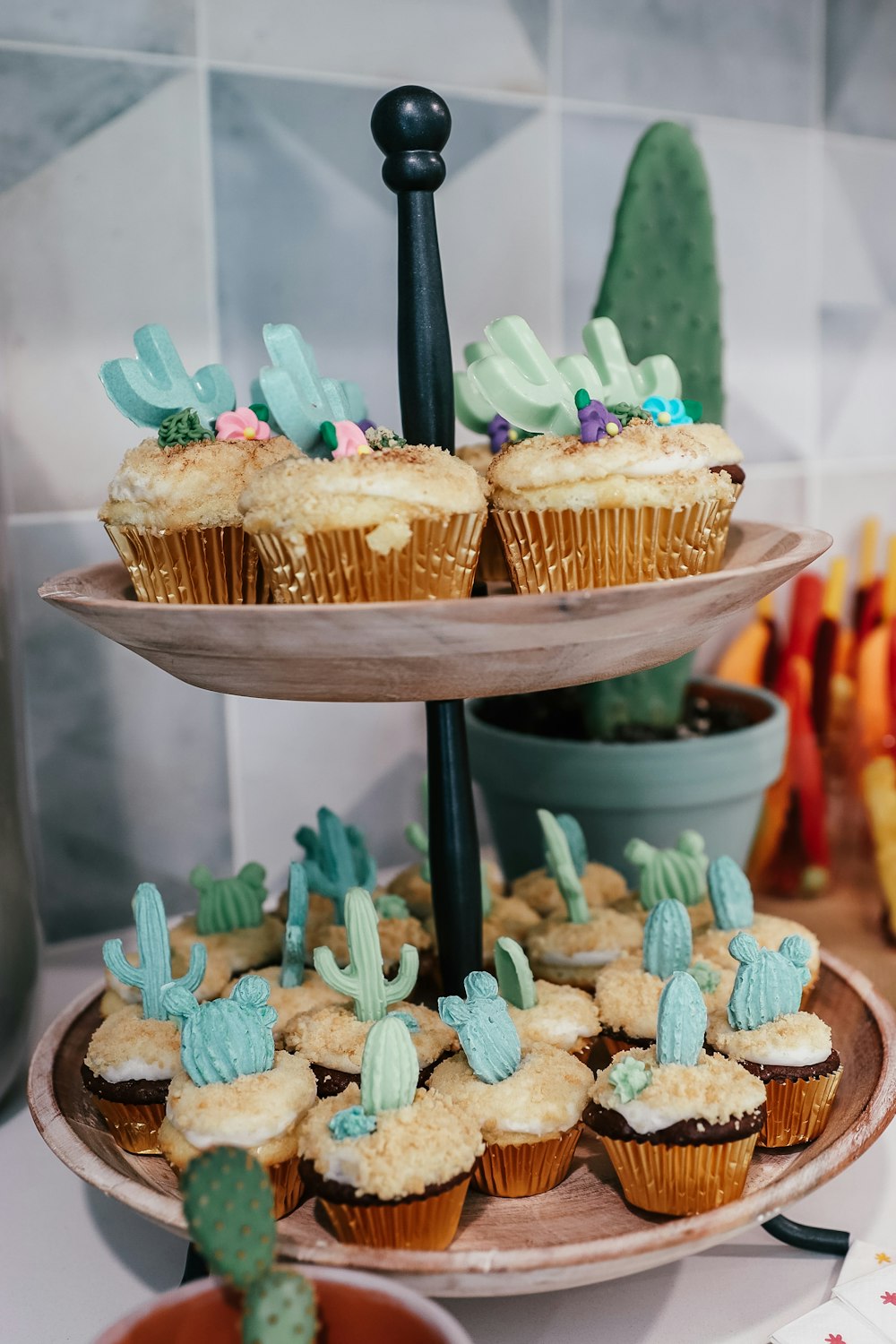 a group of cupcakes with green frosting and sprinkles on top