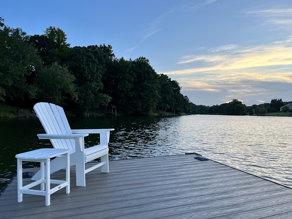 a white bench on a dock