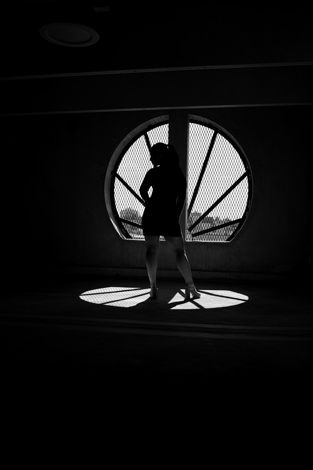 a person standing in front of a circle with a circle in the middle