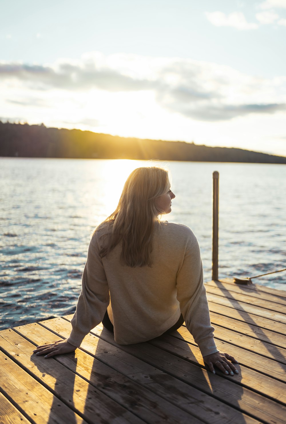 a person sitting on a dock