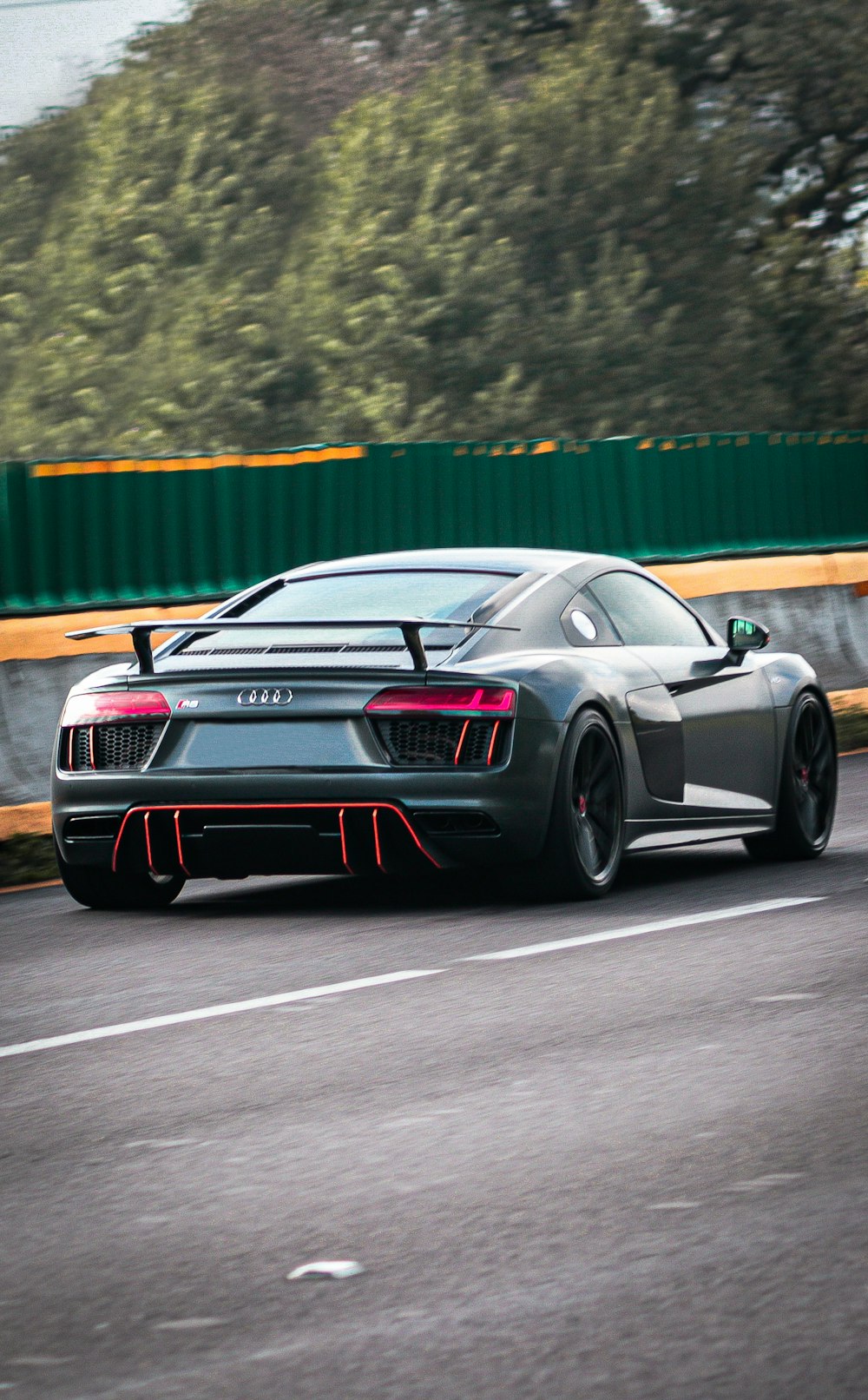 a black sports car on a road