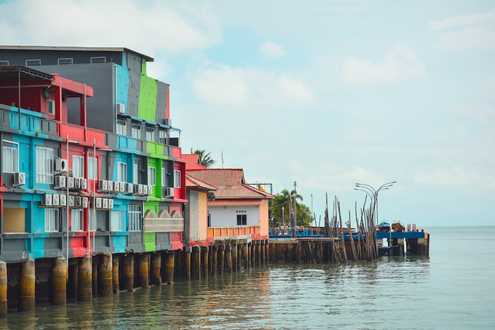 a row of colorful buildings on a dock