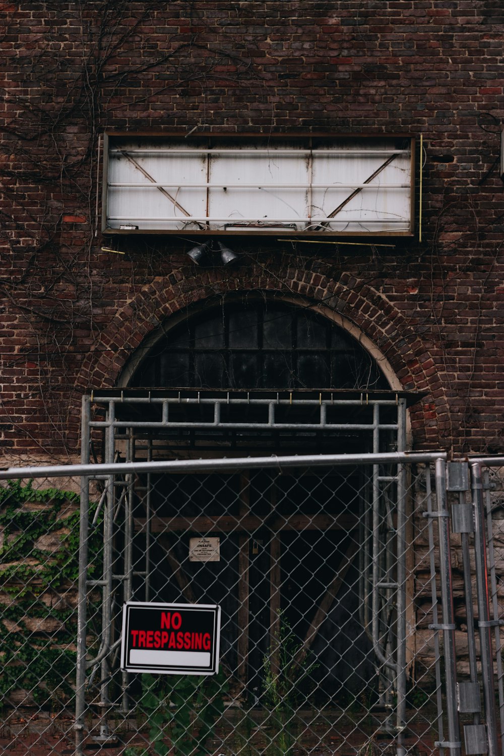 a sign on a brick wall