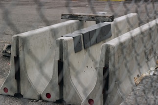A professional image of concrete slabs and barriers for sale.