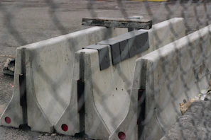 Finished concrete fences installed along a construction project perimeter.