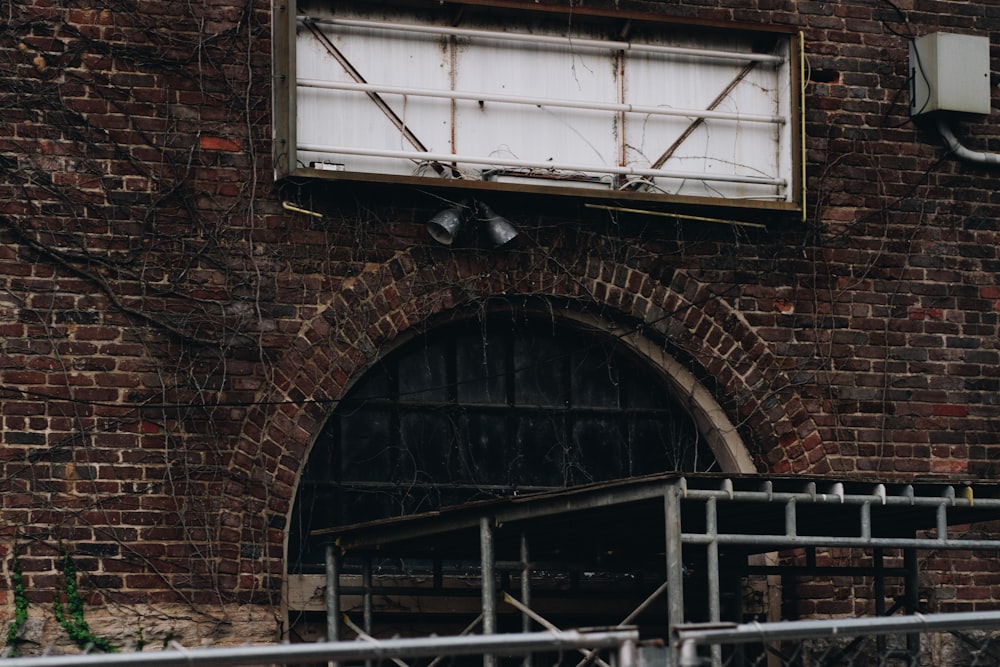 a brick building with a sign on it