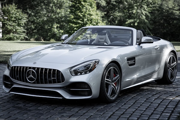 Silver sports sedan parked for a rental handover