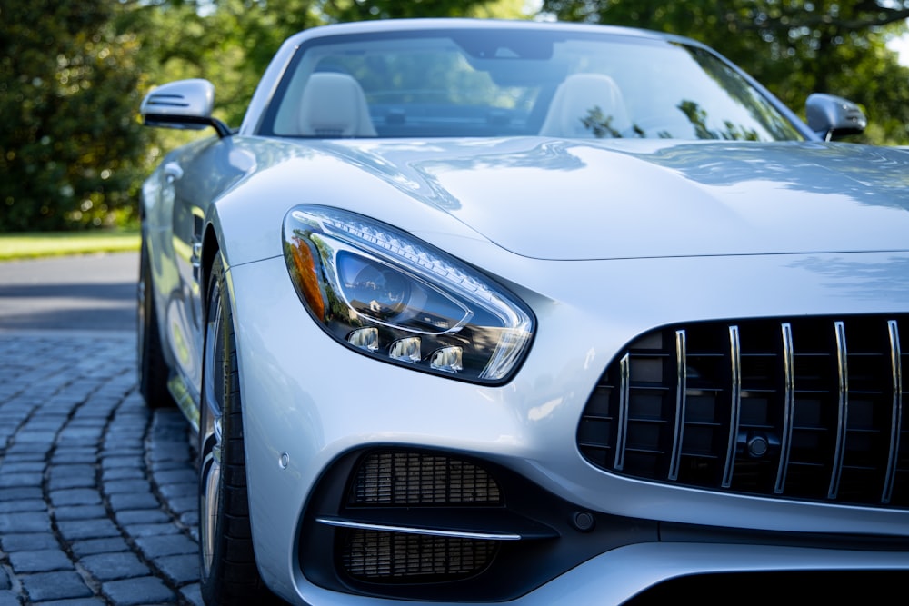 a silver car parked on a street