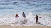 Children playing happily at the beach house in Lewes, Delaware, supported by paddleboard sales.