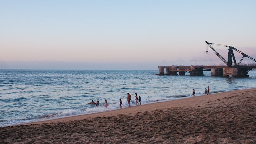 a group of people on a beach