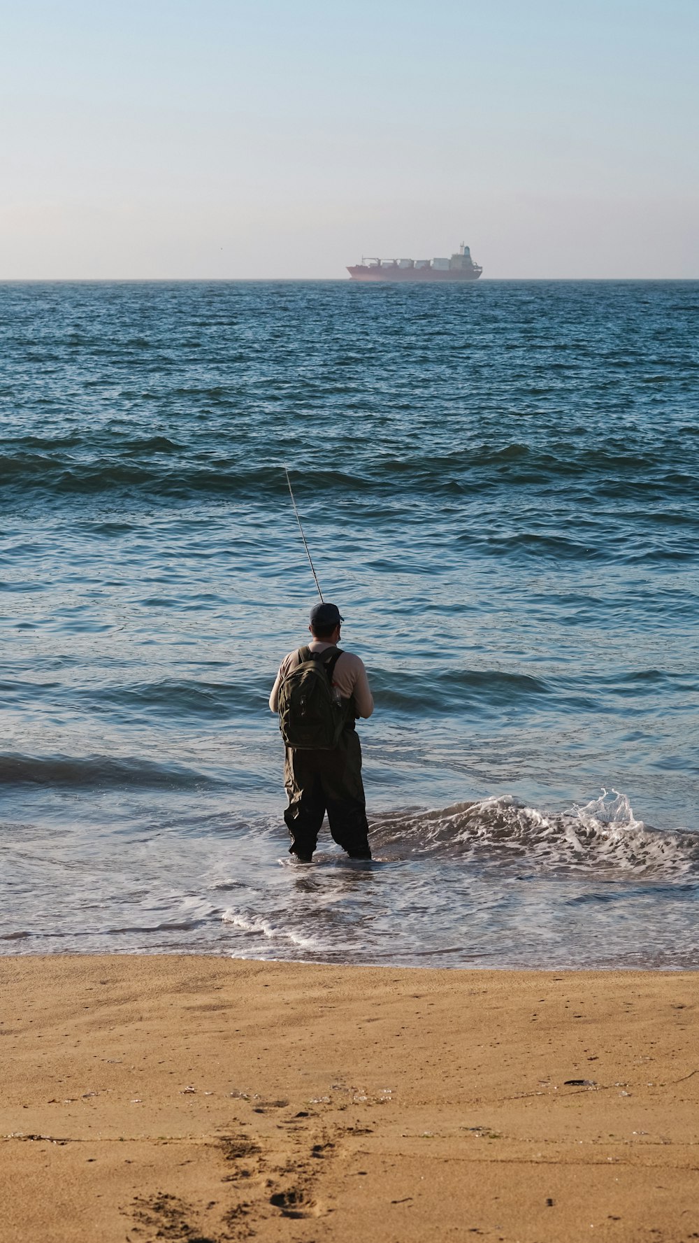 a man fishing on a beach