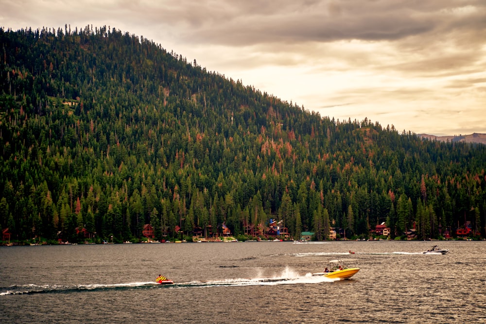 a couple of boats float on the water