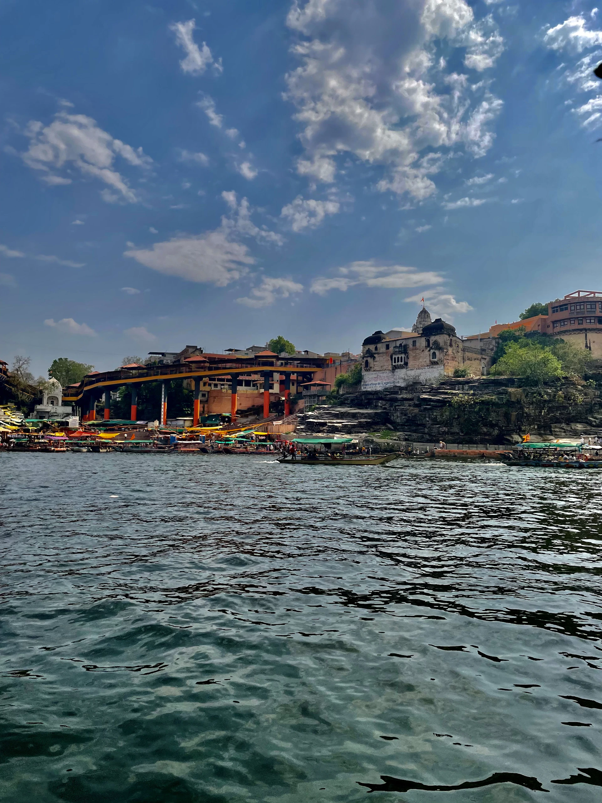 woman wearing yellow long-sleeved dress under white clouds and blue sky during daytime
